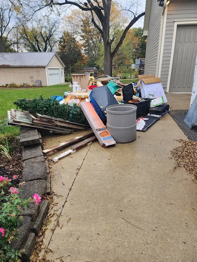 Dumpster being loaded with debris for Demolition Dumpster Rental in Kennett
